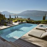 an elegantly renovated swimming pool with a view